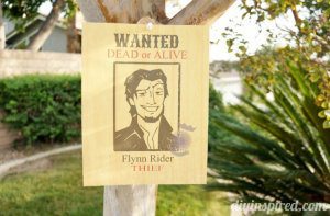 Tangled party wanted poster hung in a tree for a Tangled party.