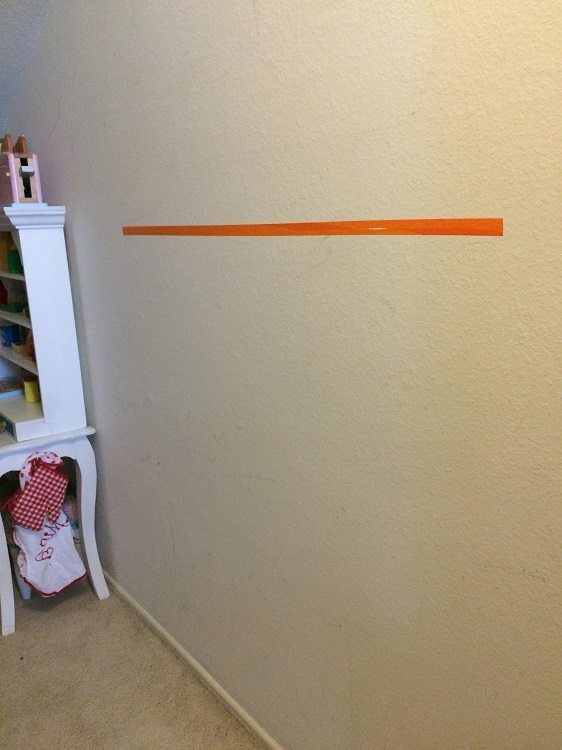 Easy Way to Hang Pictures with Two Hooks (2)