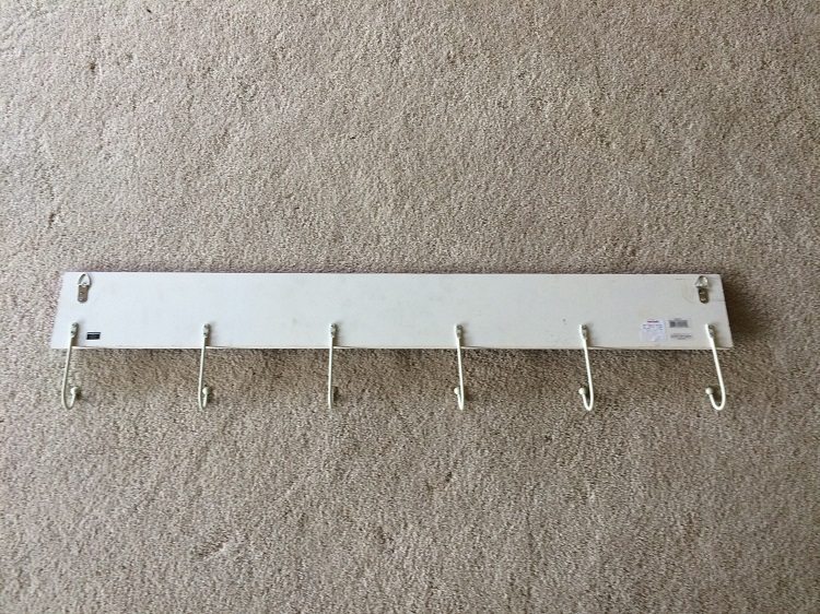 Easy Way to Hang Pictures with Two Hooks (5)