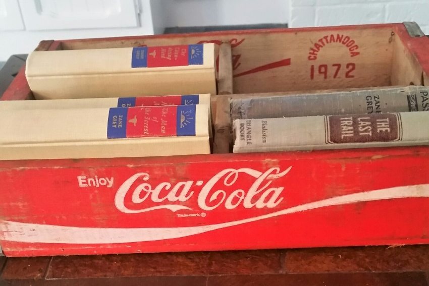 Repurposed Coca Cola Boxes as Book Storage