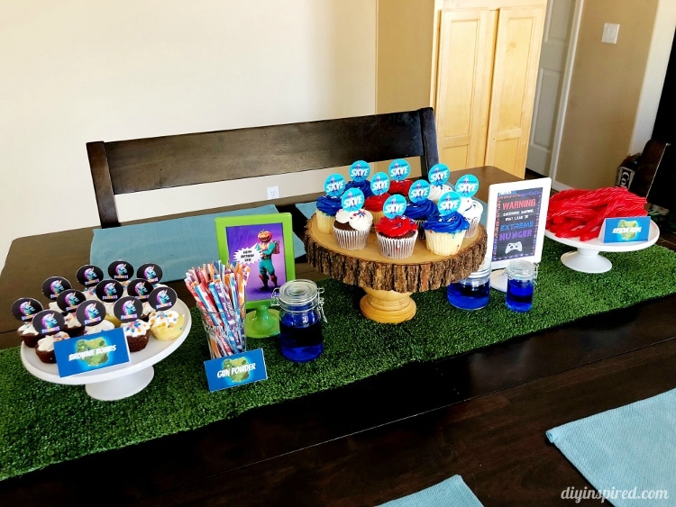jars as decorations we filled them with water and blue food coloring i also used black and tan table clothes fake green grass and halloween netting - fortnite theme party invitations